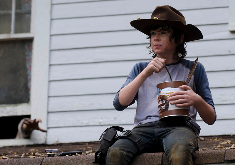 Illustration for article titled βThe Walking Dead's Carl is so bad at the zombie apocalypse, you guys